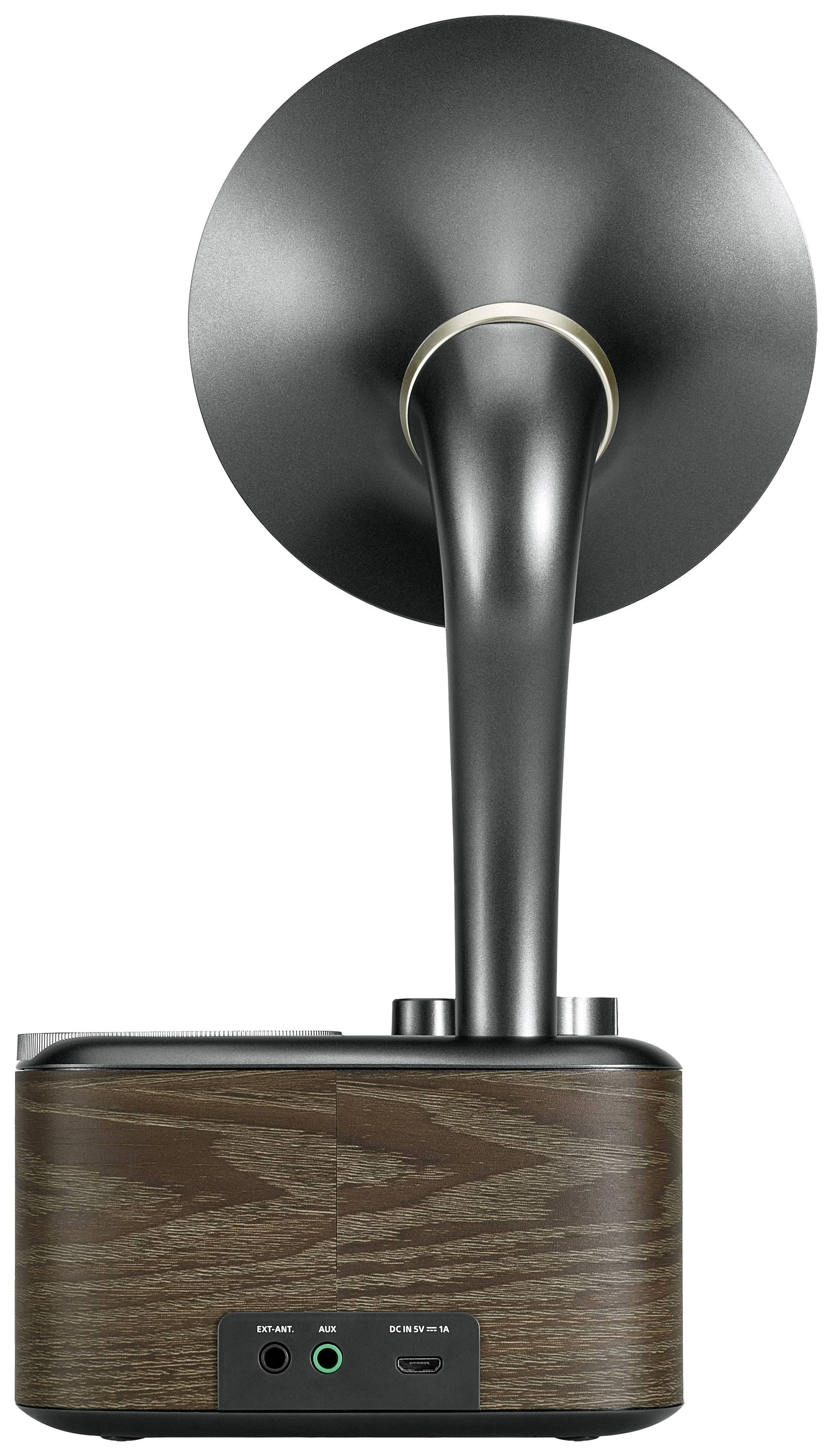 A modern loudspeaker with a large, metallically gleaming horn attachment on a wooden base with connections at the rear.