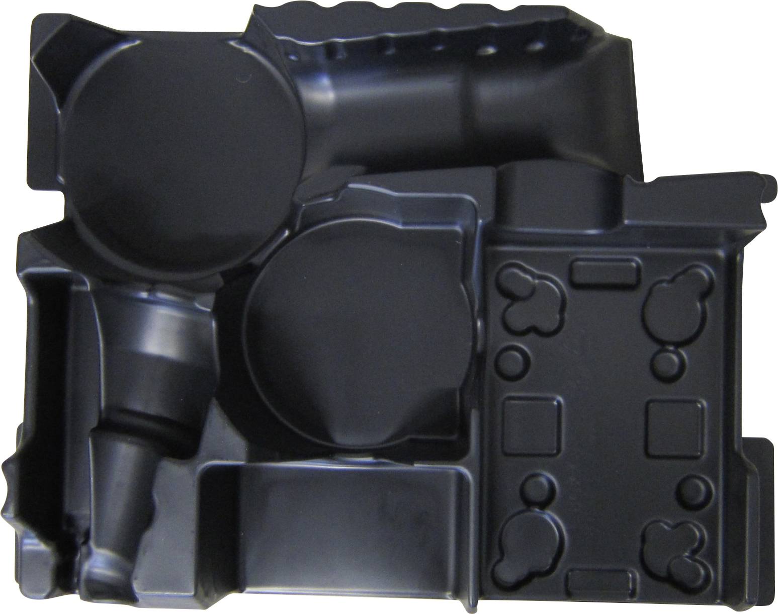 Black plastic moulded component with multiple formed recesses and protrusions, likely for packaging and storing electronic equipment.