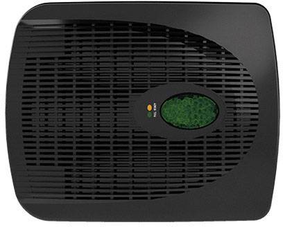 Black air purifier with an oval green display in the centre. Device shows operational status.