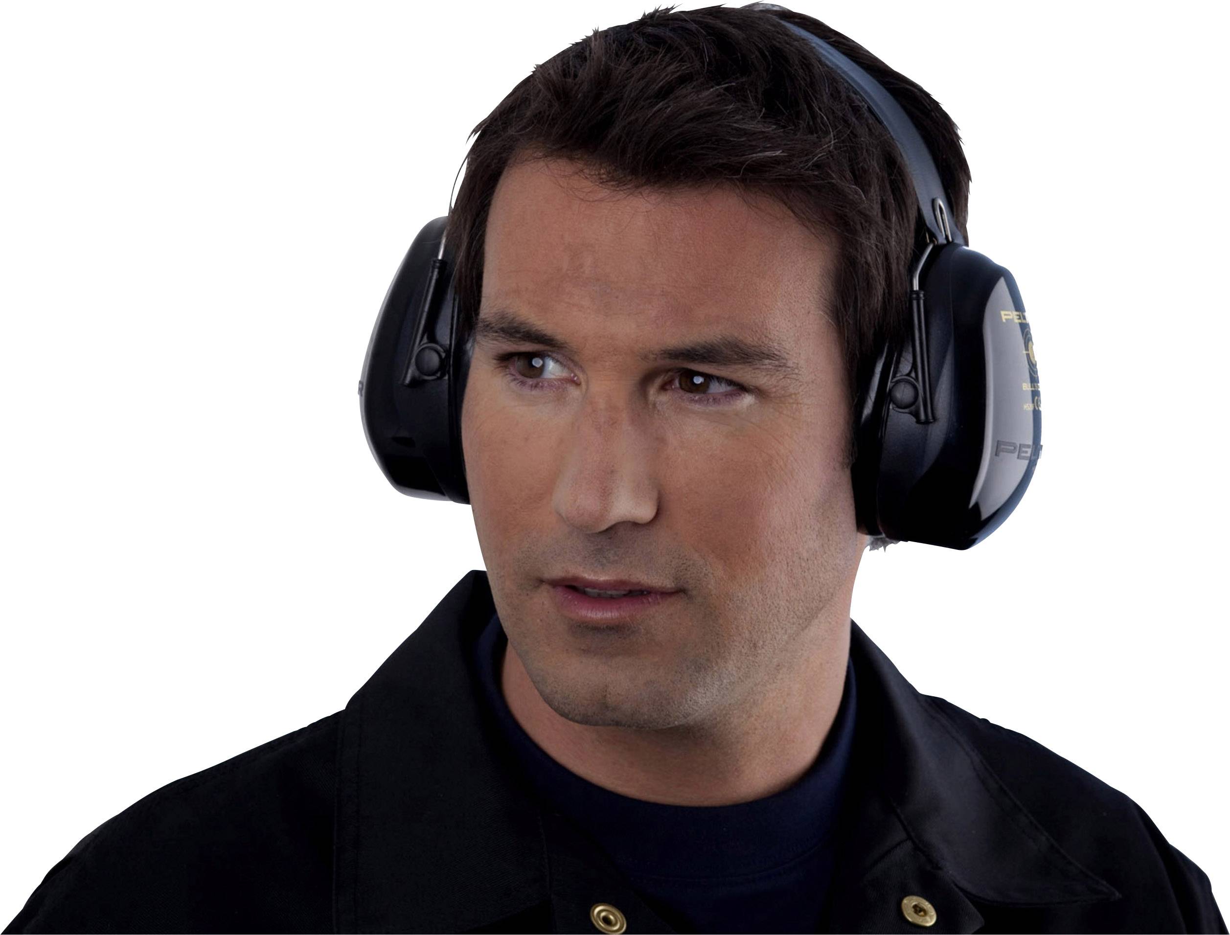 A man is wearing ear defenders. He is looking to the side and wearing a jacket.