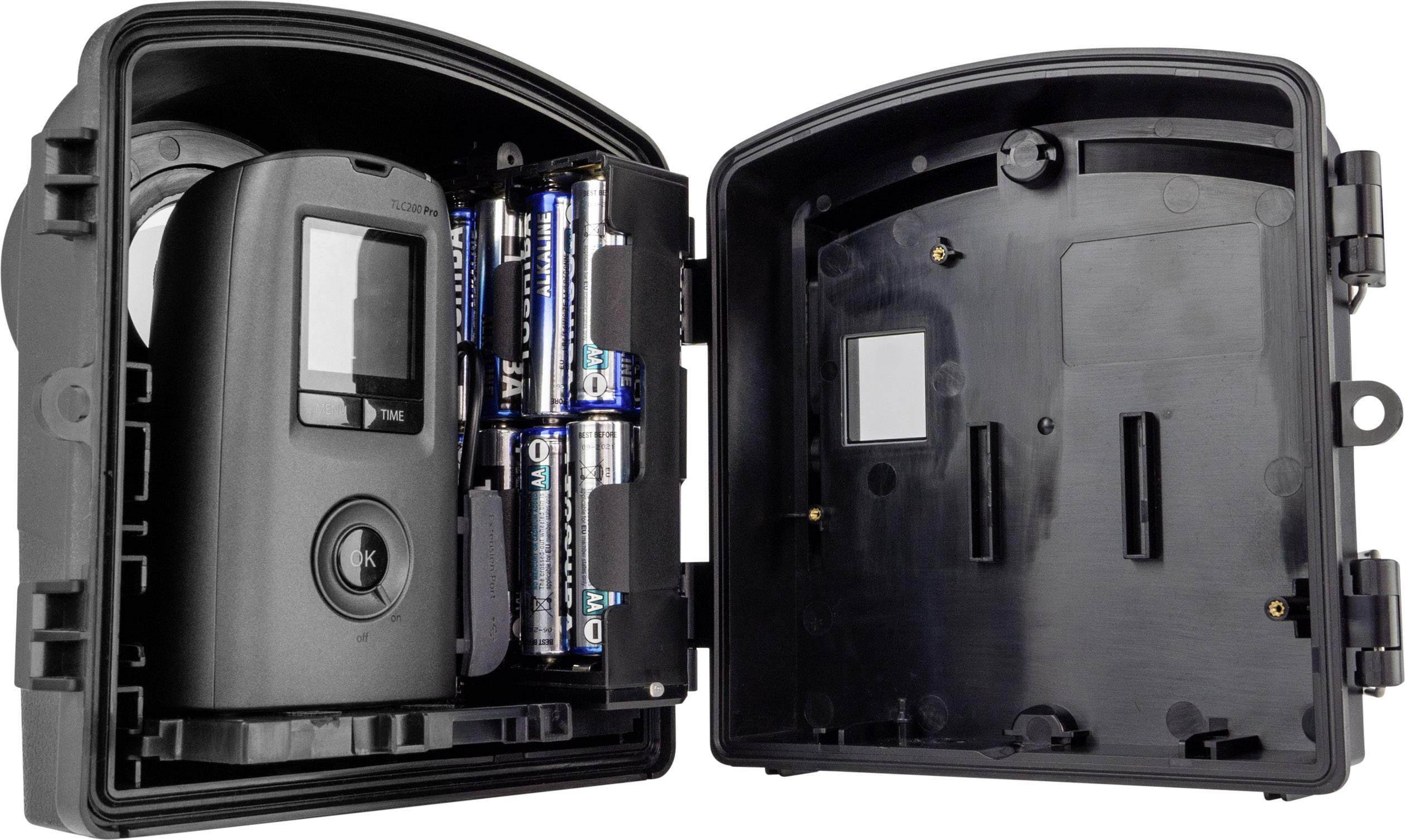 Digital timer in an open casing with batteries on the left-hand side.