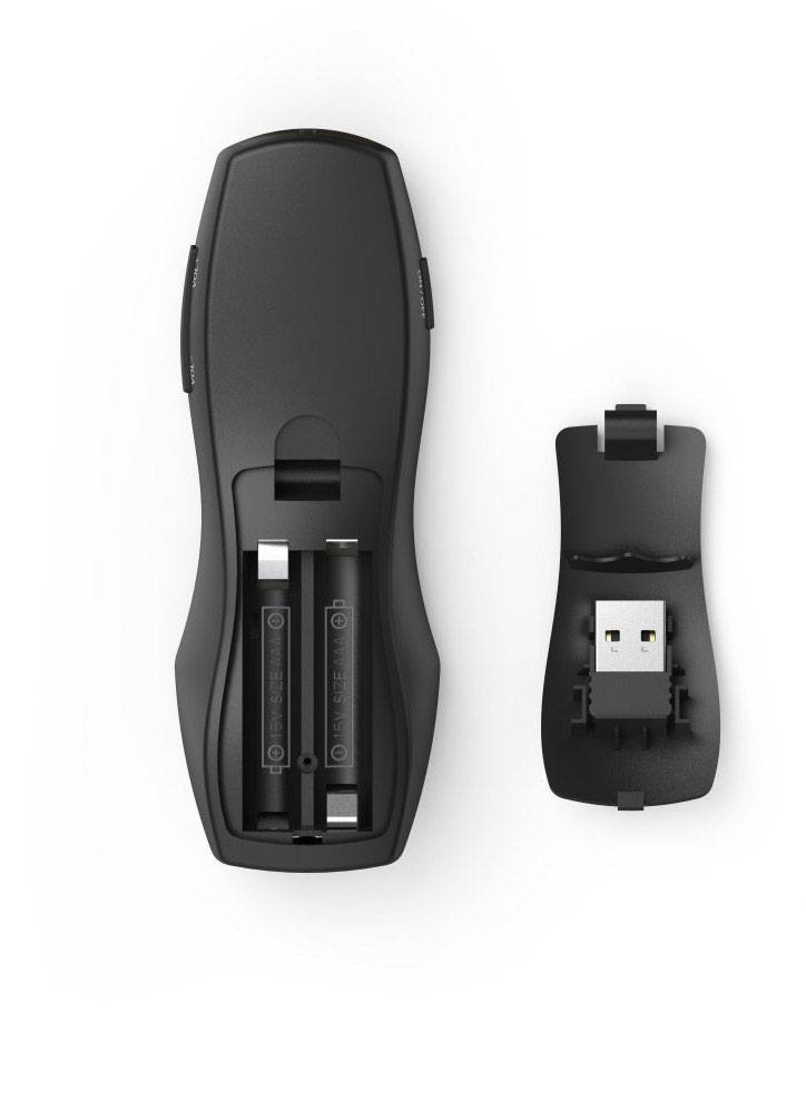 A black remote control with a removable back panel, revealing the battery compartment and USB receiver, lies on a white background.
