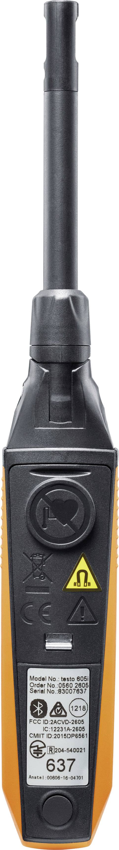 A long, black and orange measuring device with multiple symbols and text on the front, including a warning symbol.