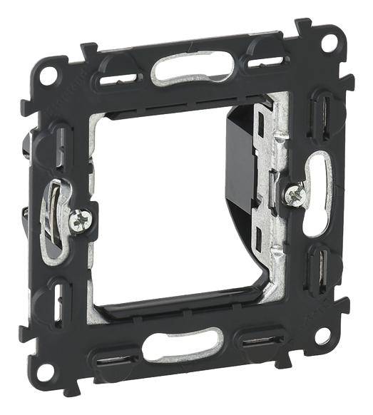 'Legrand UP switch frame without centre section and mounting plate, square-shaped with black terminals on the sides.'