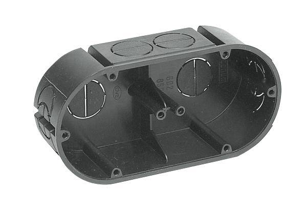 Electrical flush-mounted socket made of black plastic, oval in shape, with multiple round cable entry points on the sides.