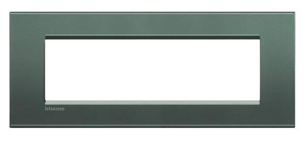 Green rectangular frame with a central cutout, used for electrical switch or socket covers.