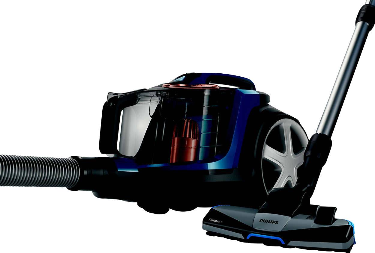 Vacuum cleaner with a transparent container, black and blue details, silver suction tube and brush attachment against a white background.