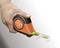 A hand is holding a 5-metre long measuring tape by Bahco. The measuring tape is partially extended.