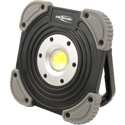 A portable, black LED work light with robust grey corners and a central, bright illumination source.