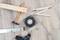 'Construction tools on wooden floor: piece of wood, hammer, ruler, spanner, spirit level, drill and screws.'