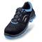 Black safety shoe with blue accents and non-slip sole. Perforated upper material for ventilation, stylish and functional.