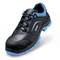 A black safety shoe with blue accents and a robust sole, suitable for industrial use.