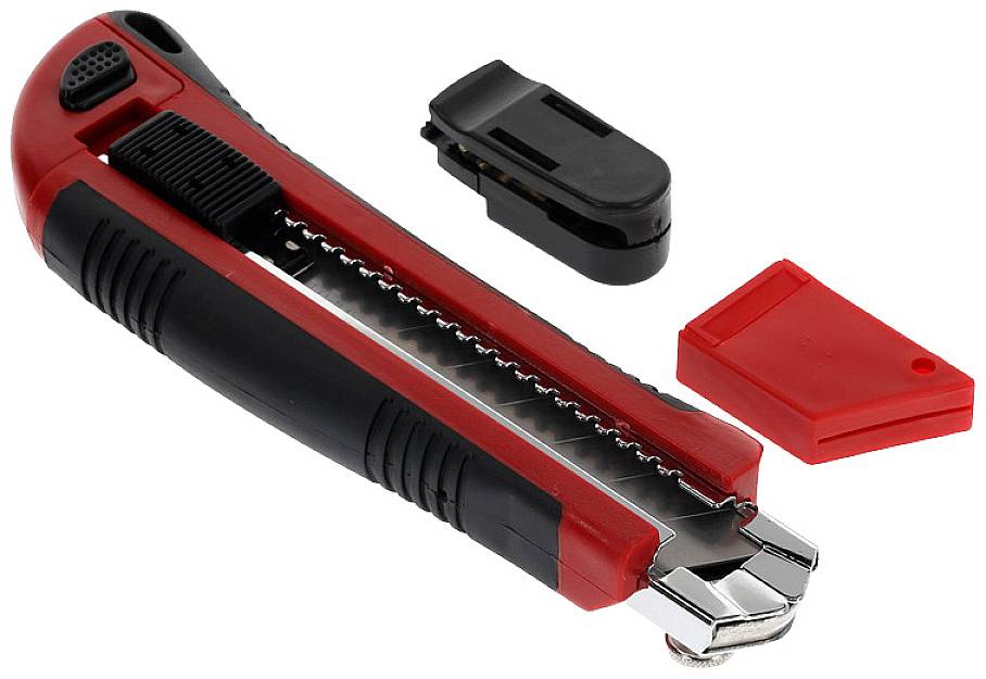 A red and black universal craft knife lies with its blade extended, cover, and clip beside it on a white surface.