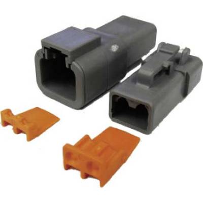 Two black plastic plugs, each with an orange closure. Suitable for electrical connections.
