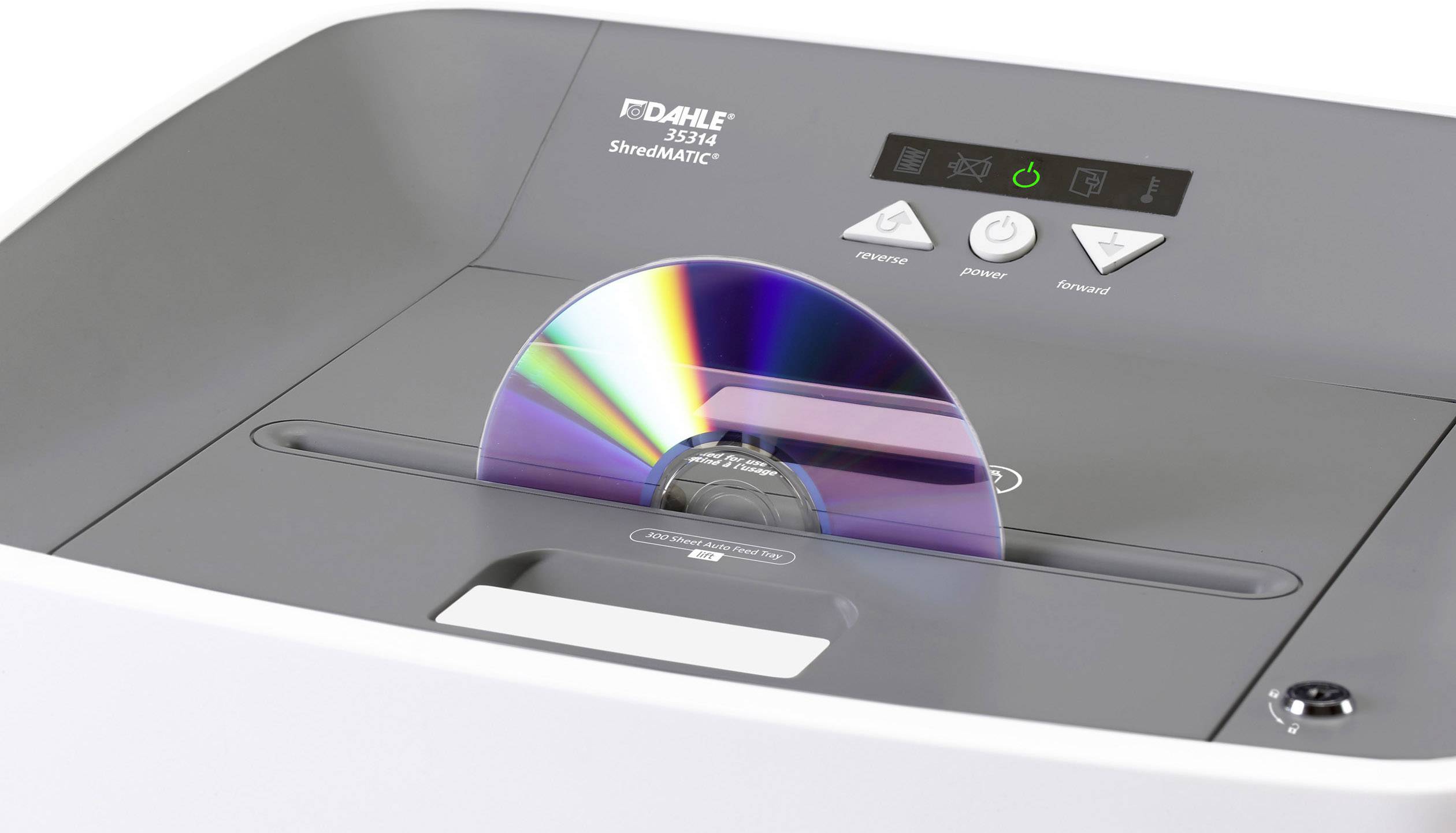A CD shredder with a CD partially inserted into the slot demonstrates the device's ability to shred CDs.