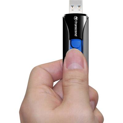 A hand is holding a black Transcend USB stick with a blue sliding switch.