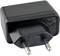 Black power supply with two round metal pins, suitable for European power sockets.