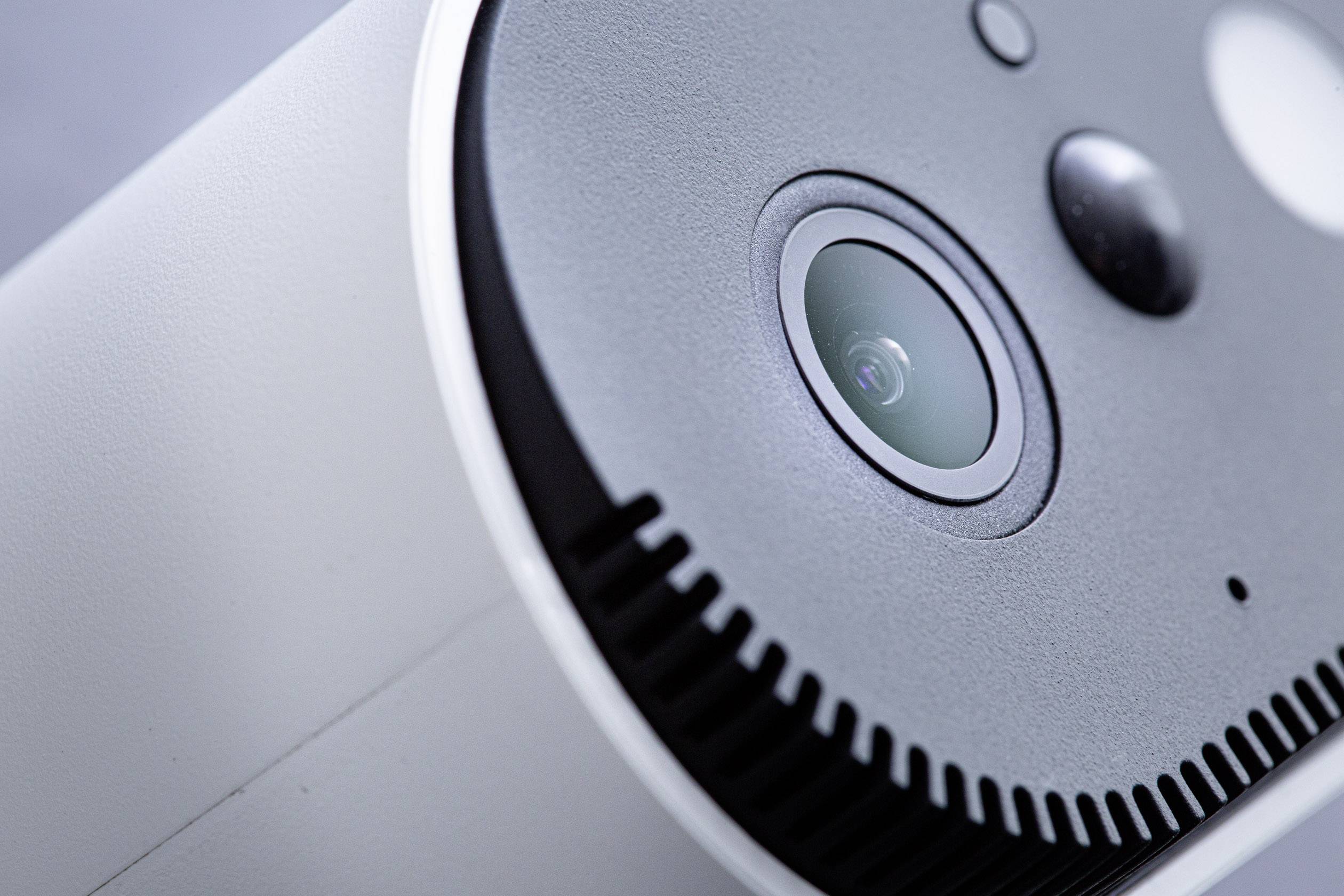 Close-up of a surveillance camera sensor with visible lens and sensor details.