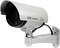 Metal surveillance camera mounted on the wall, facing left.