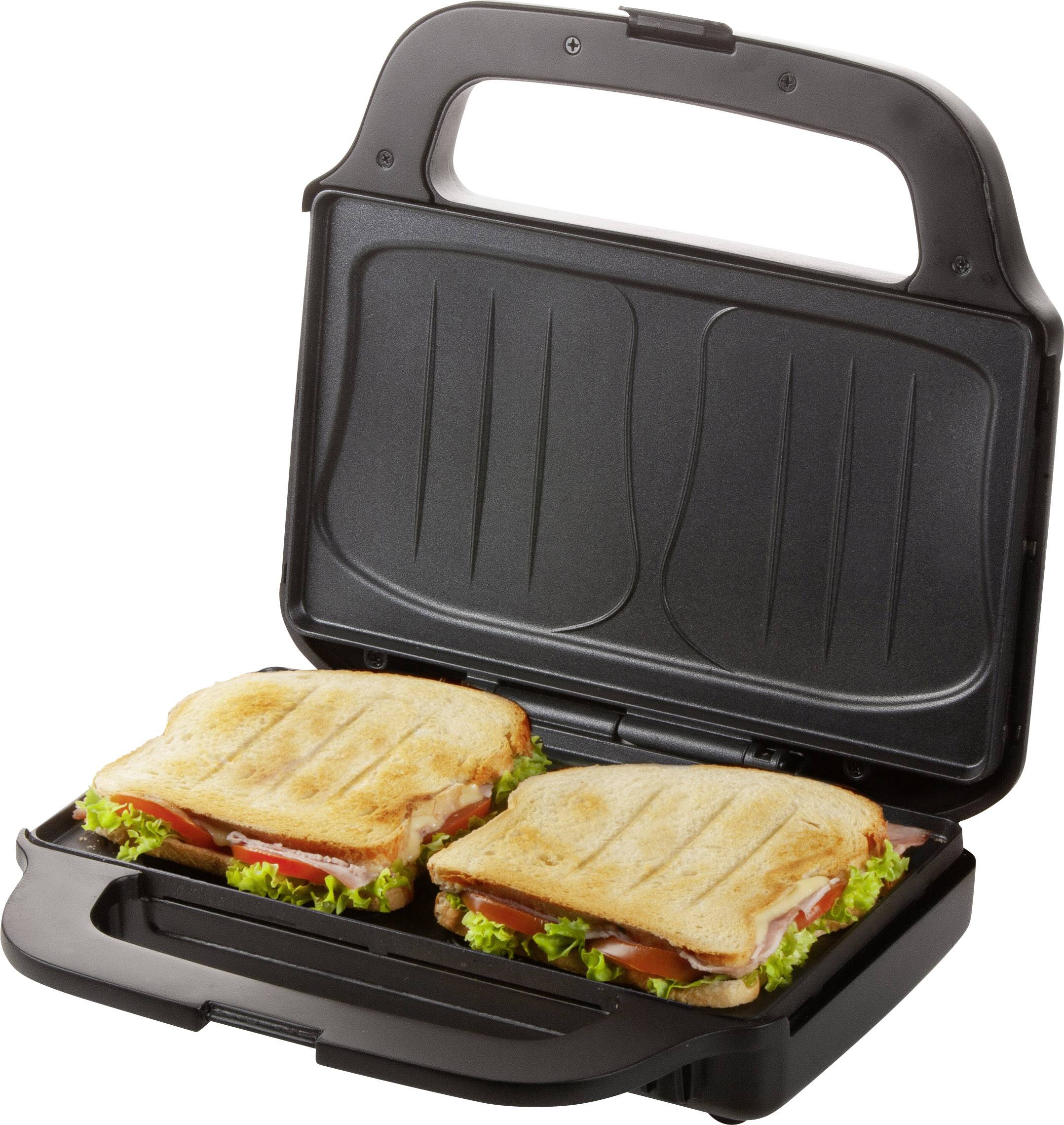 Two golden-brown toasted sandwiches with lettuce and tomato in a black sandwich toaster.