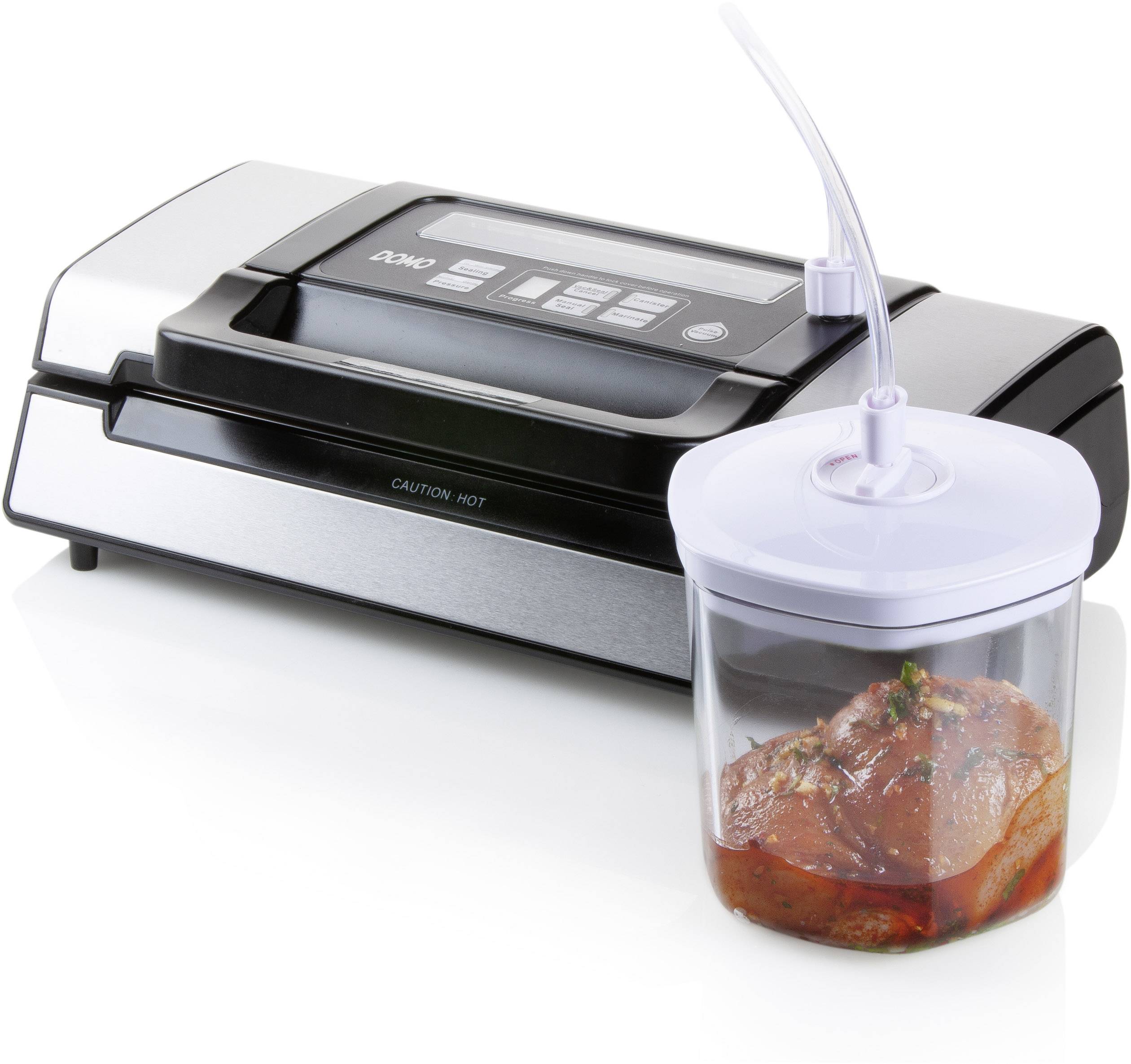 Vacuum sealing machine with a container in which raw meat is being vacuum sealed. Device shows digital display and control buttons.