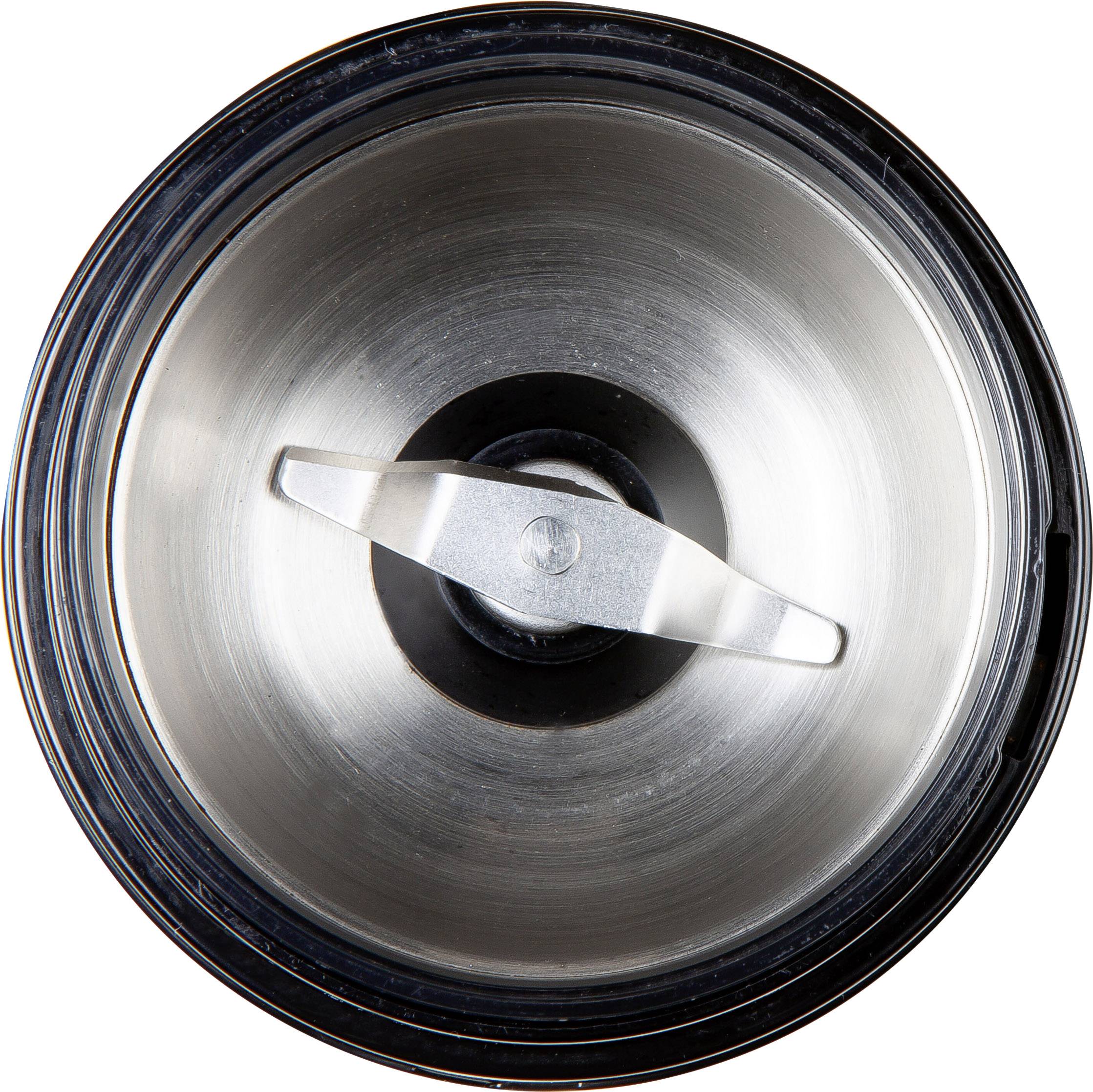 Mixer attachment with metal cutting blade in the centre, viewed from above.