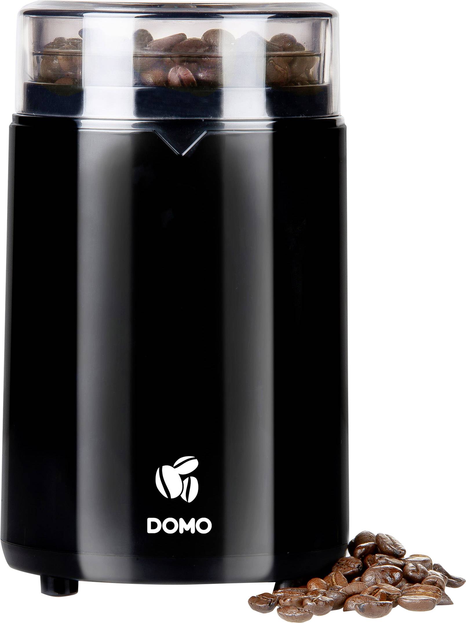 Black electric coffee grinder with a full bean chamber and some coffee beans beside it on a white surface.