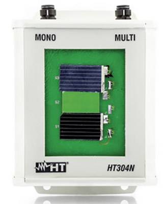 An electrical device, marked with 'MONO', 'MULTI' and 'HT304N', displays wired electronic components on a green circuit board.