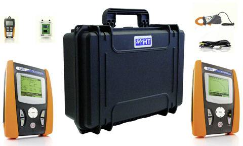 Various measuring instruments and a black transport case. Devices display digital readings, used for technical or scientific measurements.