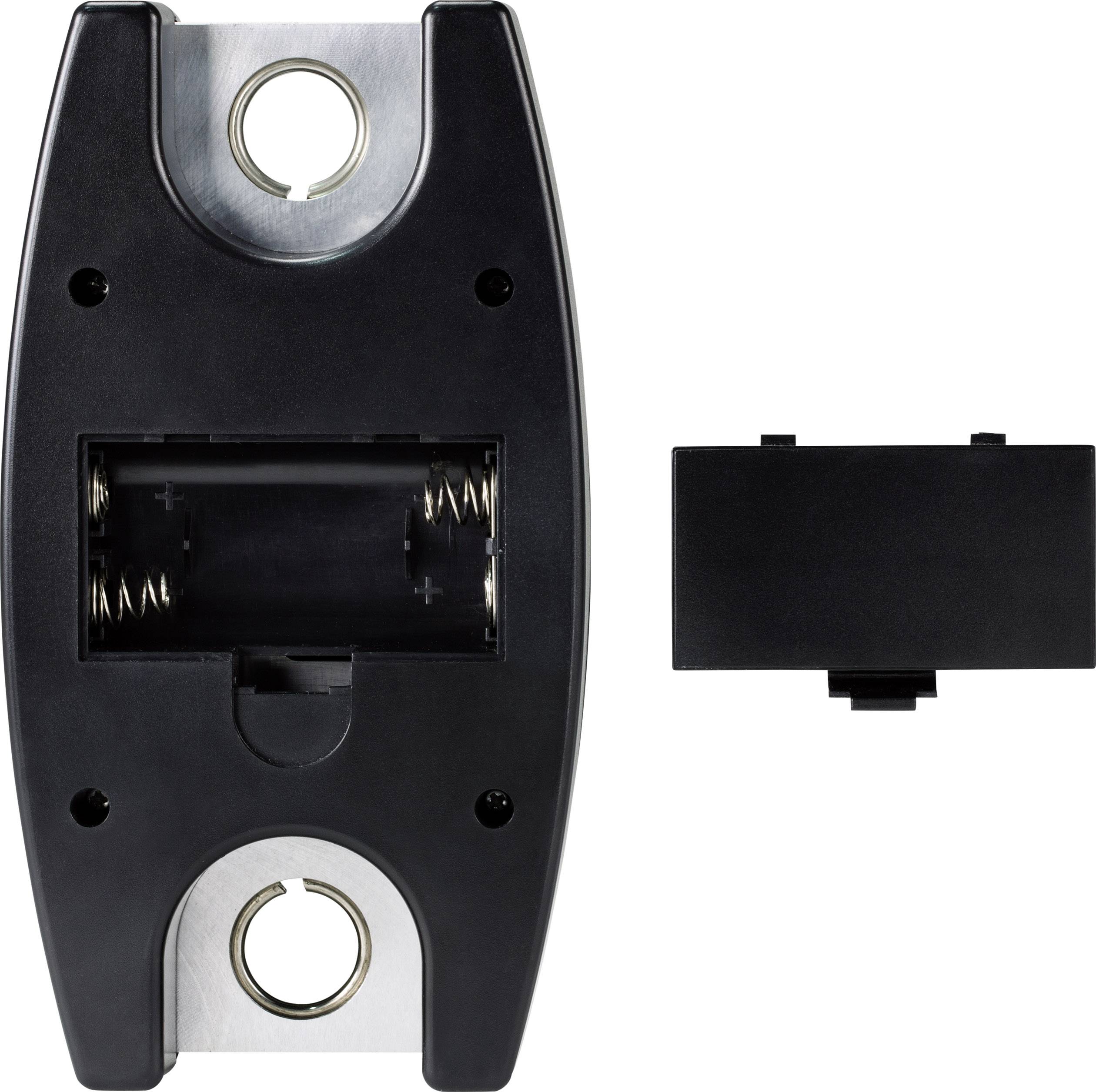 A black, battery-powered device with an open battery compartment next to a detached, rectangular black cover.