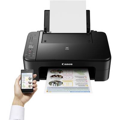A black printer is printing a colourful page. A hand is holding a smartphone that shows a connection to the printer.