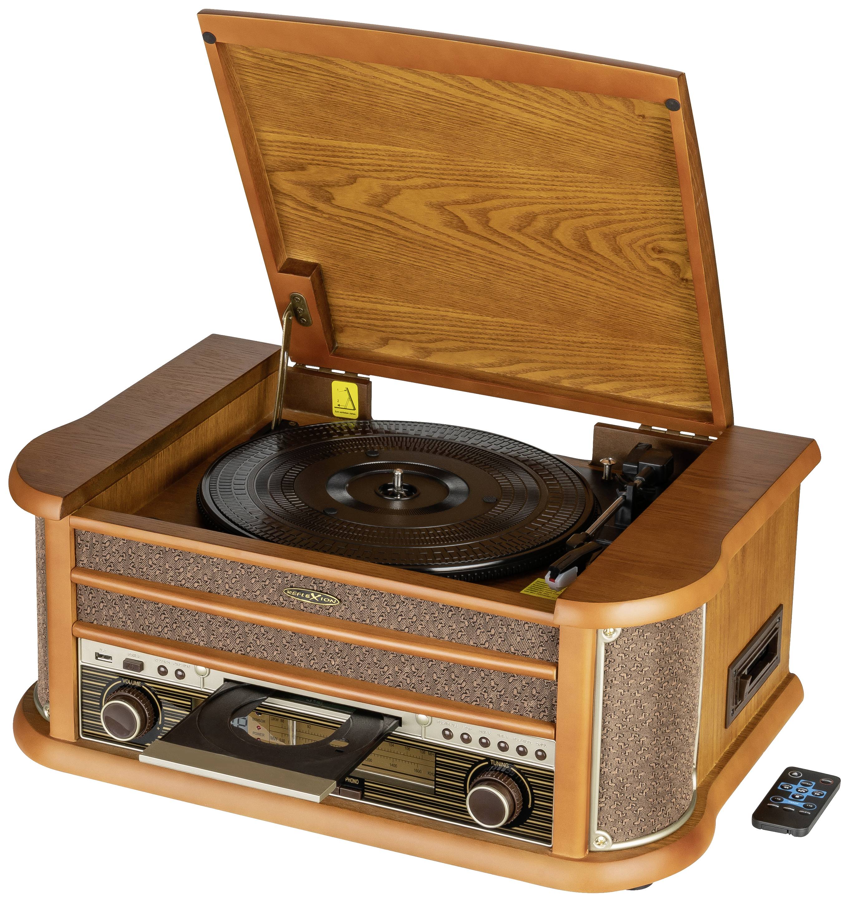 A vintage wooden record player with an open lid. A vinyl record is placed on the turntable. A small remote control lies beside it.