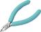 A turquoise side cutter with ergonomic handles, used for cutting through wires and small metal parts.