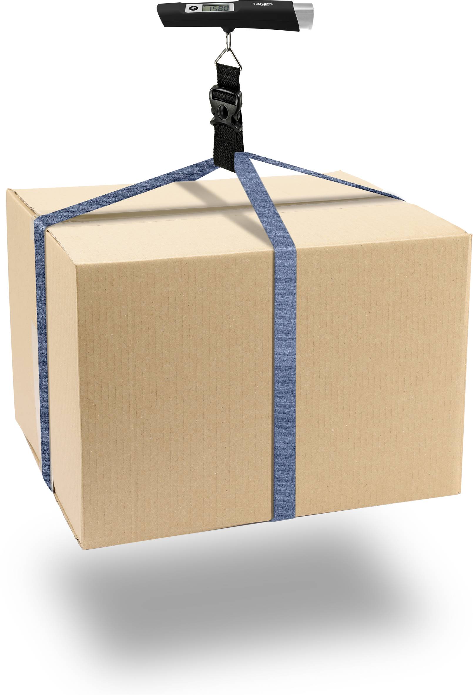 A brown cardboard box, wrapped with blue straps, hangs from a luggage scale. The display on the scale shows '0.0' kilograms.