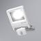 A white LED floodlight with a motion sensor mounted on a grey wall. It emits bright light and features a brand logo.
