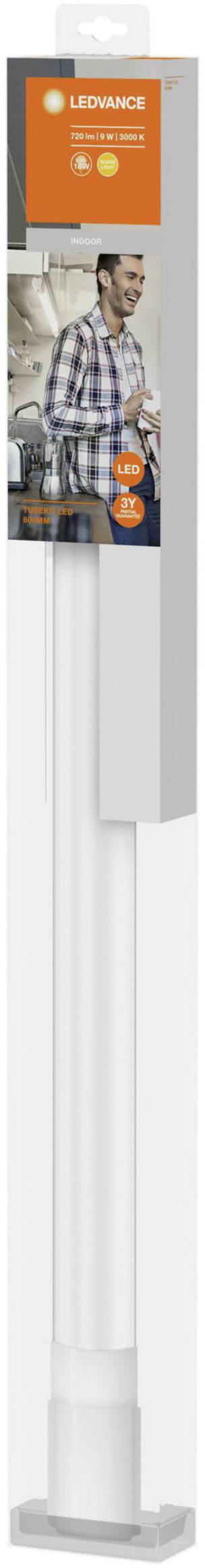 'LEDVANCE light strip shows a smiling man with a tool in the background. Suitable for modern living spaces.'