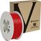 A reel of red 3D printer filament from the Verbatim brand next to a brown packaging with the Verbatim logo.