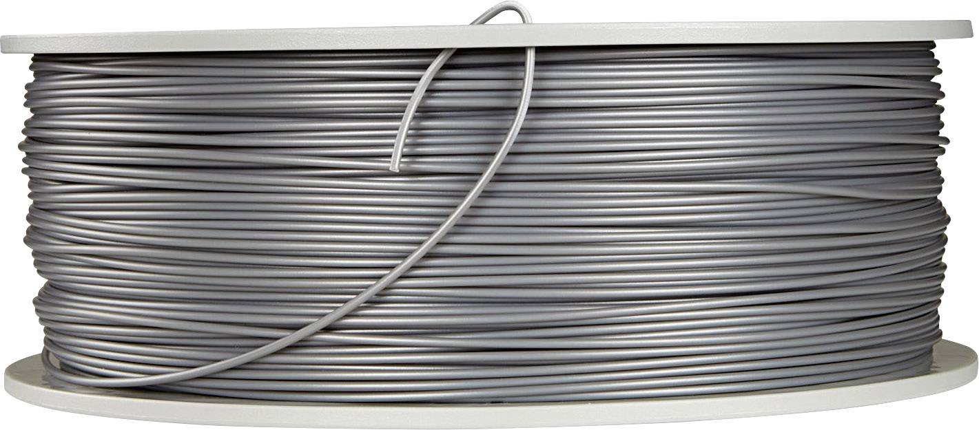 A large reel of silver-coloured wire or cable is tightly wound and held horizontally on a spool.