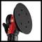 Eccentric sander with a red housing and black sanding disc, suitable for smooth surface processing in workshop environments.