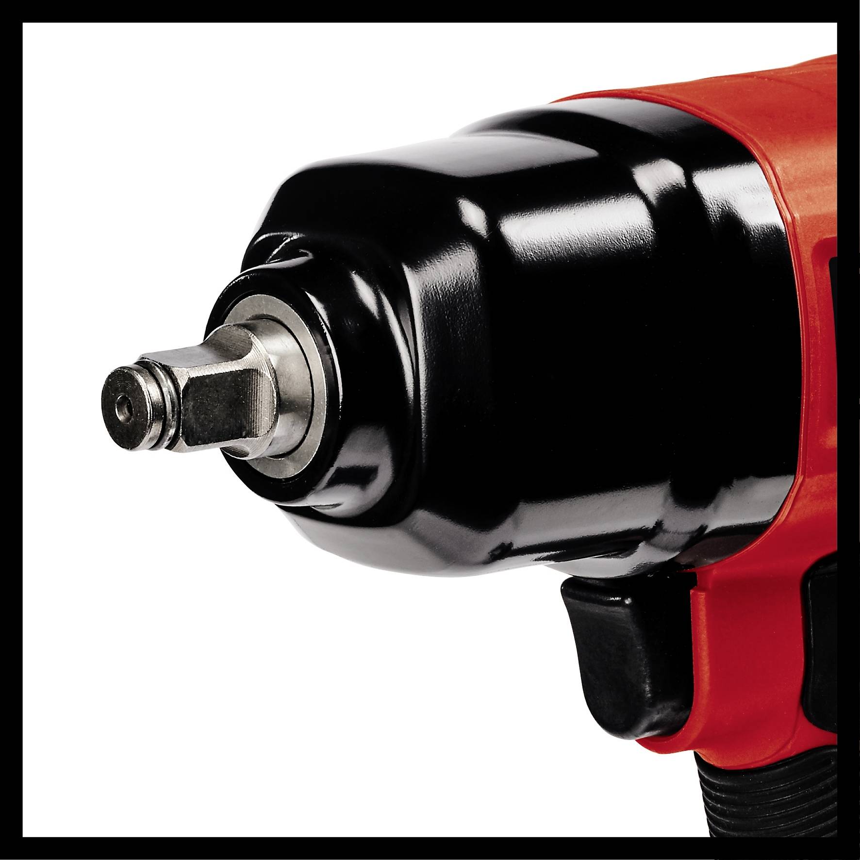 A red pneumatic screwdriver in close-up, showing the tip and part of the tool. Suitable for use in workshops.