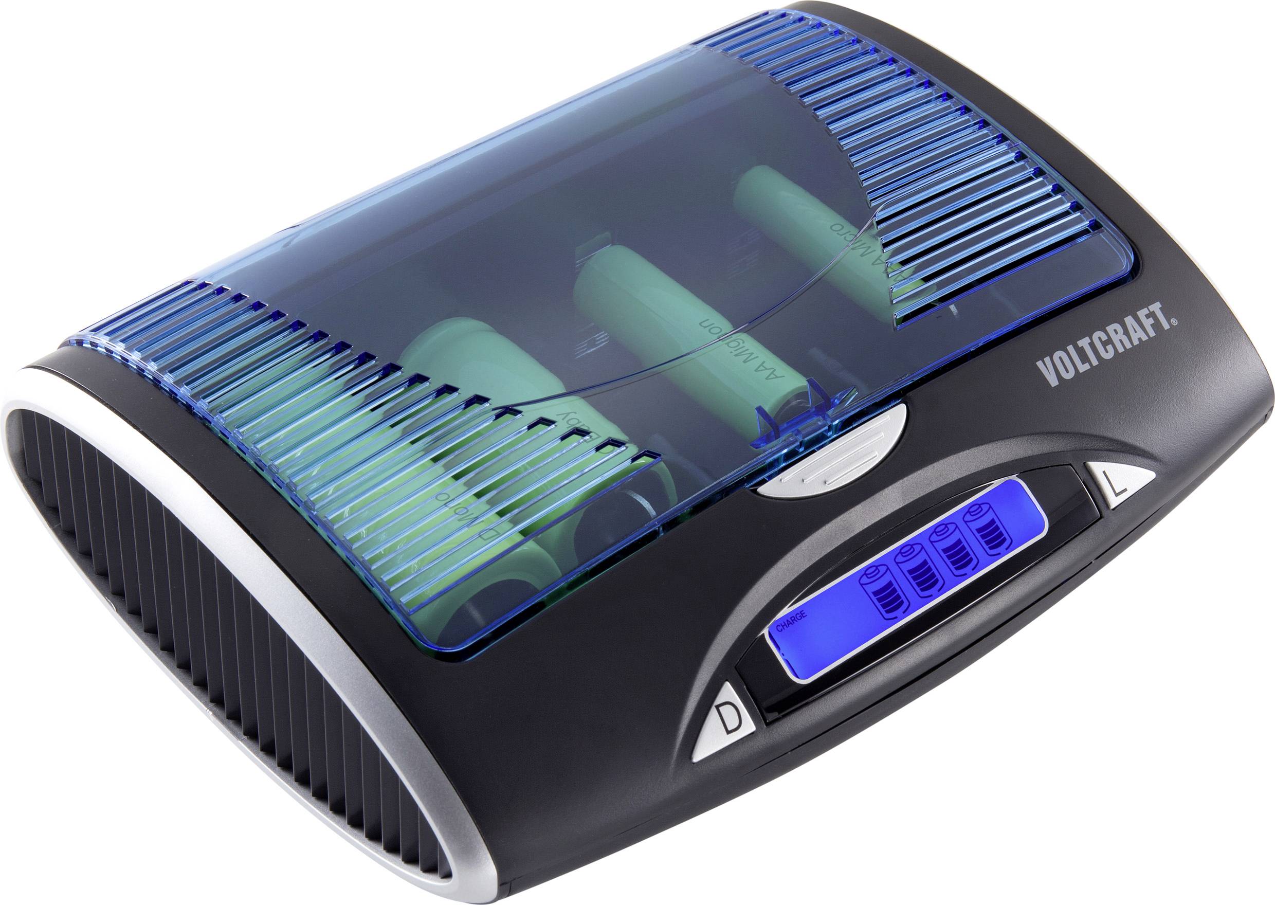 Battery charger by Voltcraft with a blue display and transparent lid, showing four green AA batteries.