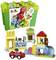 LEGO Duplo building set with coloured bricks, bear and dog figures, car-like vehicle and accessories, suitable from 18 months.