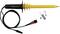 Yellow and red testing device with cable and accessories for voltage measurement. Includes hooks, metal screw, and terminal attachment.