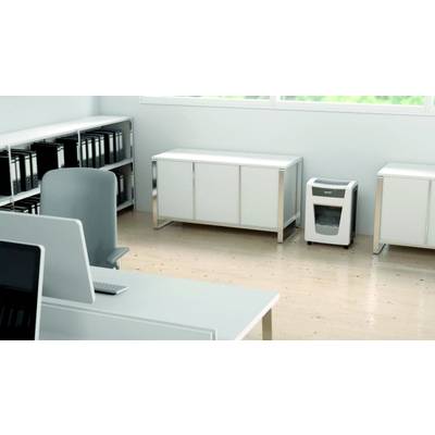 Office with desks, shelves and a shredder on a light wooden floor. Bright, minimalist design.