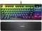 Mechanical keyboard with RGB backlighting, wrist rest, and volume control dial located in the top right corner.