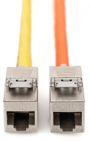 Two fibre optic connectors with yellow and orange cable, close-up.