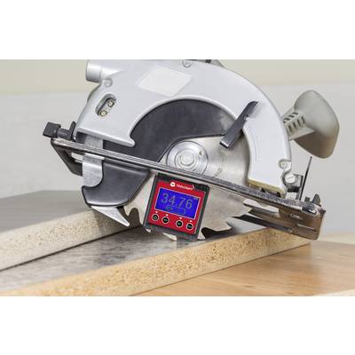 Circular saw cutting a wooden board. A digital angle measuring device is positioned between the saw blade and the wood, showing '34.76°'.