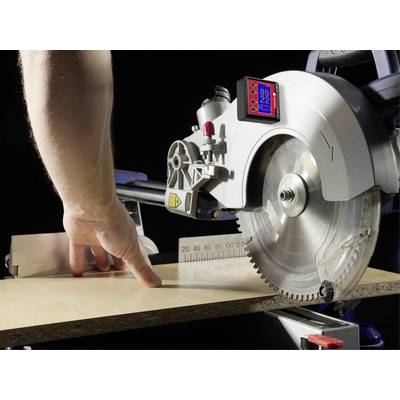 A person is cutting a wooden board with a circular saw. A digital screen displays the saw's settings.