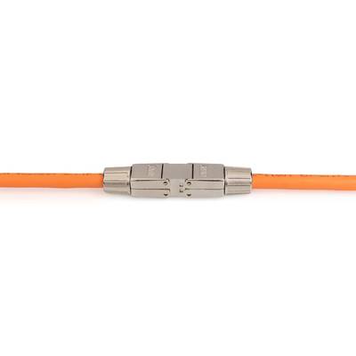 An orange cable is connected to a silver metal plug that could serve as an adapter or coupling.