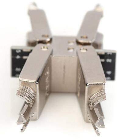 Silver, metallic heatsink clip design with four arms, used in computer hardware for heat dissipation.
